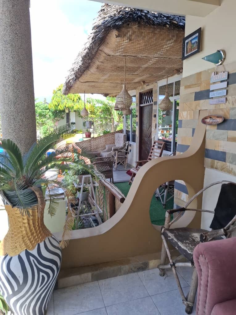 Babajay Home veranda with plants and guest seating